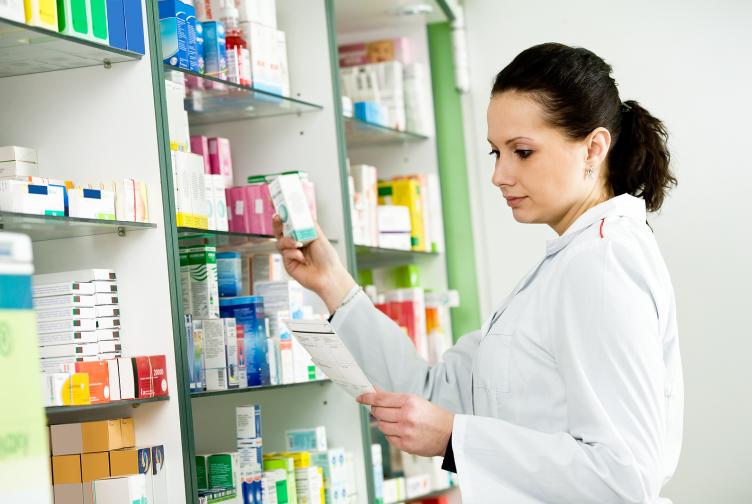 Large numbers of forged prescriptions are being presented at some pharmacies Pharmacist choosing medications